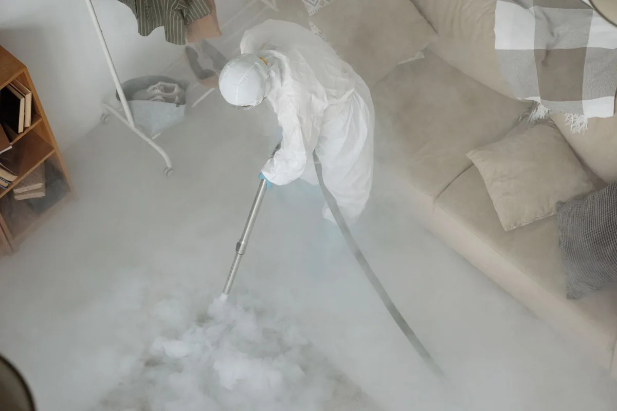 Biohazard cleanup technician in protective equipment, Hyde Park, Austin, TX